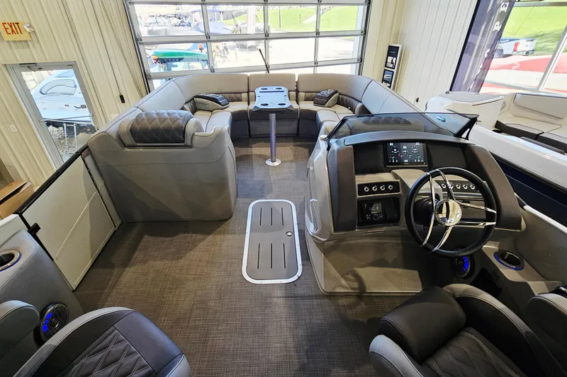 Slide: The Image of Luxurious interior of 2024 Bennington RX 23 RXFBA pontoon boat with modern helm and seating. - 10