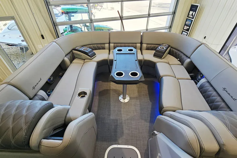 Slide: The Image of Luxurious interior of 2024 Bennington RX 23 RXFBA pontoon boat with plush seating and cup holders. - 11