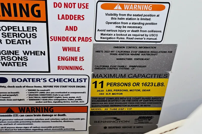 Slide: The Image of 2024 Bennington RX 23 RXFBA warning labels and capacity information on boat interior. - 19