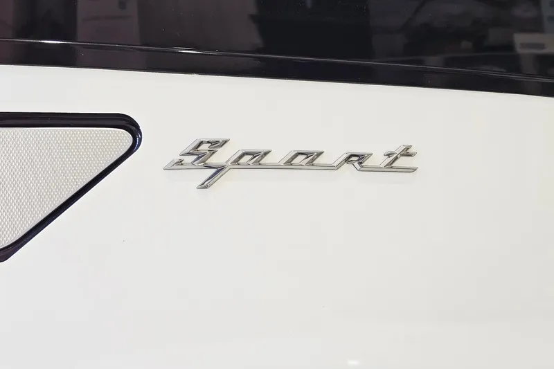 Slide: The Image of 2024 Bennington RX 23 RXFBA boat with 'Sport' emblem on white surface. - 21