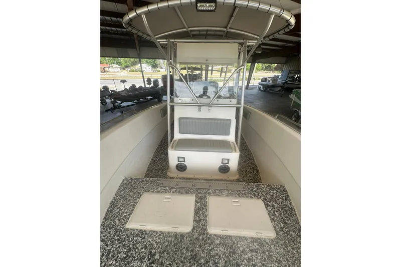 Slide: The Image of 2002 Cape Horn 27 XS boat interior with center console and storage compartments. - 7