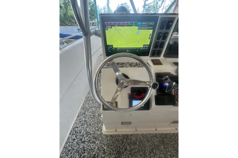 Slide: The Image of Steering console of a 2002 Cape Horn 27 XS boat with navigation display. - 8