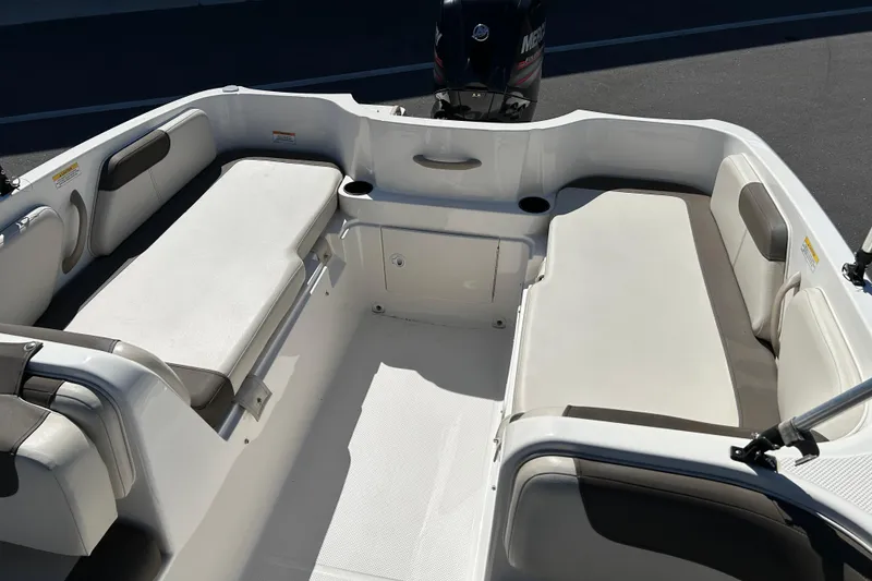 Slide: The Image of 2019 Bayliner Element E18 boat interior with spacious seating and modern design. - 12
