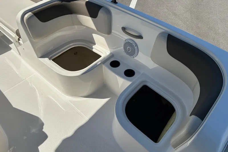 Slide: The Image of 2019 Bayliner Element E18 boat interior with seating and storage compartments. - 14