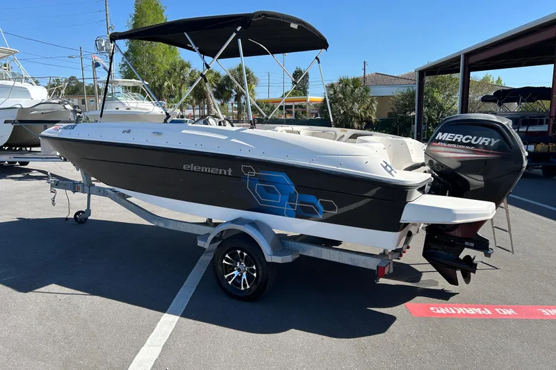 Slide: The Image of 2019 Bayliner Element E18 boat with Mercury outboard engine on trailer. - 4