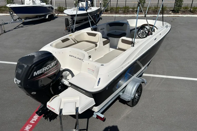 Slide: The Image of 2019 Bayliner Element E18 boat with Mercury outboard engine on trailer. - 7