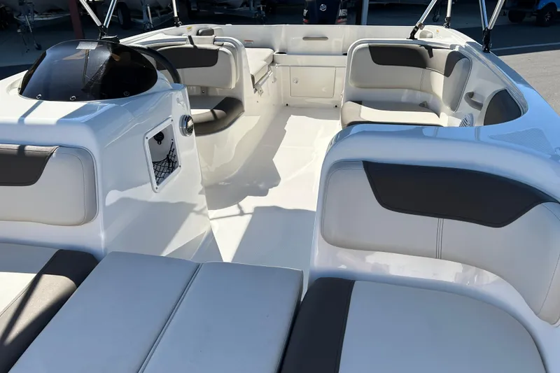 Slide: The Image of 2019 Bayliner Element E18 boat interior with spacious seating and modern design. - 9