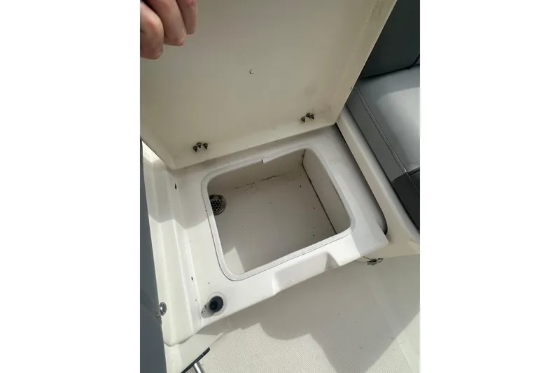 Slide: The Image of Open storage compartment on 2023 NAUTIC STAR 22 L boat, showcasing interior space. - 15