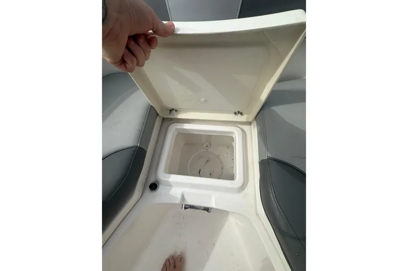 Slide: The Image of Open storage compartment on 2023 NAUTIC STAR 22 L boat, showcasing interior space. - 27
