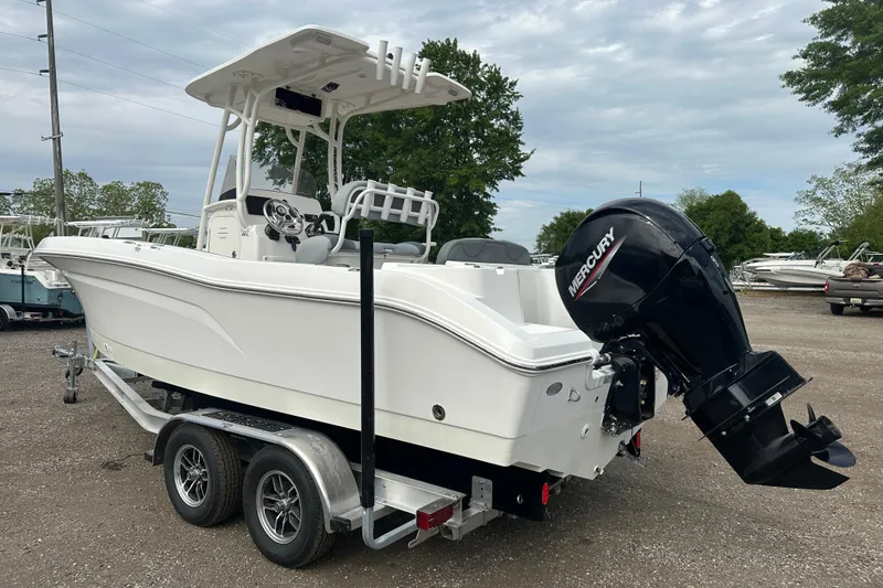 Slide: The Image of 2023 NAUTIC STAR 22 L boat on trailer with Mercury outboard motor. - 3