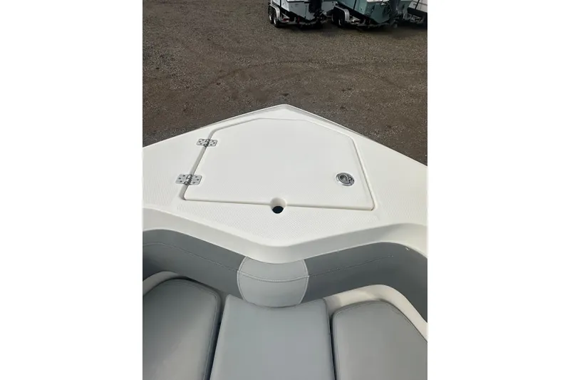 Slide: The Image of 2023 NAUTIC STAR 22 L boat bow with storage compartment and seating. - 31
