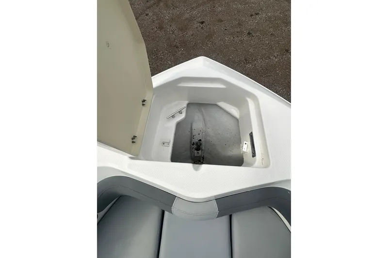 Slide: The Image of Open storage compartment on 2023 NAUTIC STAR 22 L boat, showcasing interior space. - 32