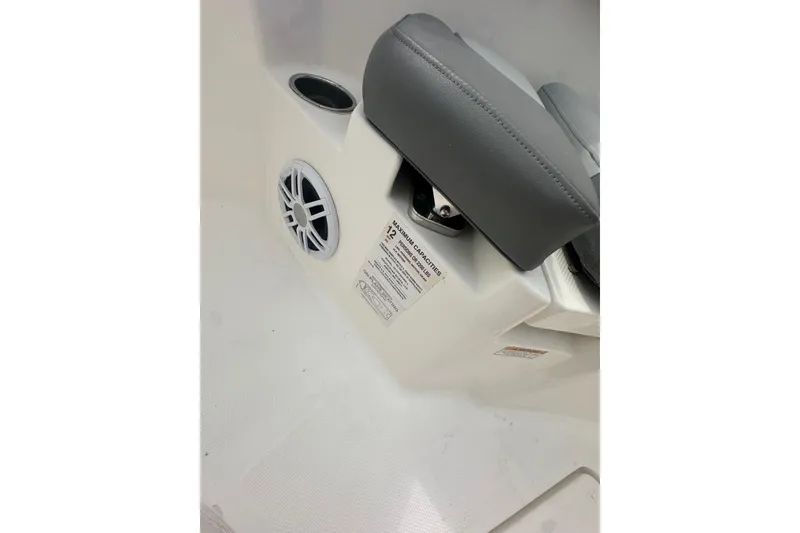 Slide: The Image of Interior of 2023 NAUTIC STAR 22 L boat showing speaker and seating area. - 36