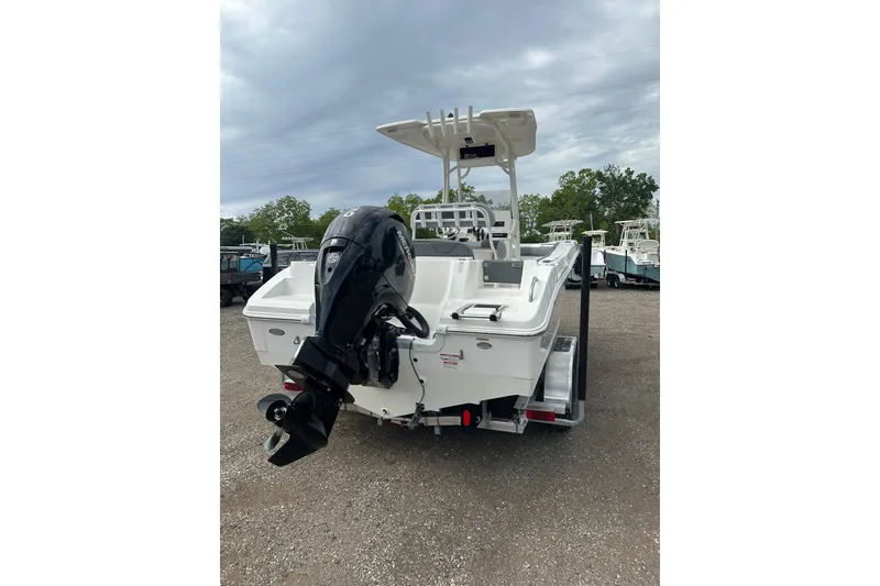 Slide: The Image of 2023 NAUTIC STAR 22 L boat with outboard motor on trailer. - 5