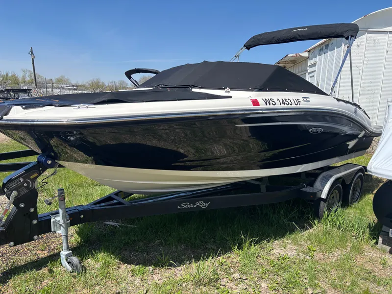 Slide: The Image of 2022 Sea Ray SPX 190 boat on trailer outdoors. - 16