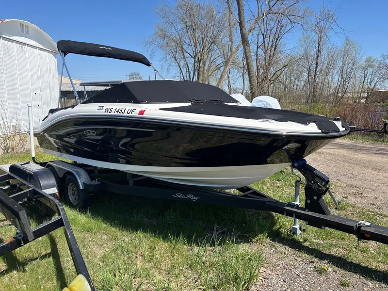 Slide: The Image of 2022 Sea Ray SPX 190 boat parked on trailer outdoors. - 17