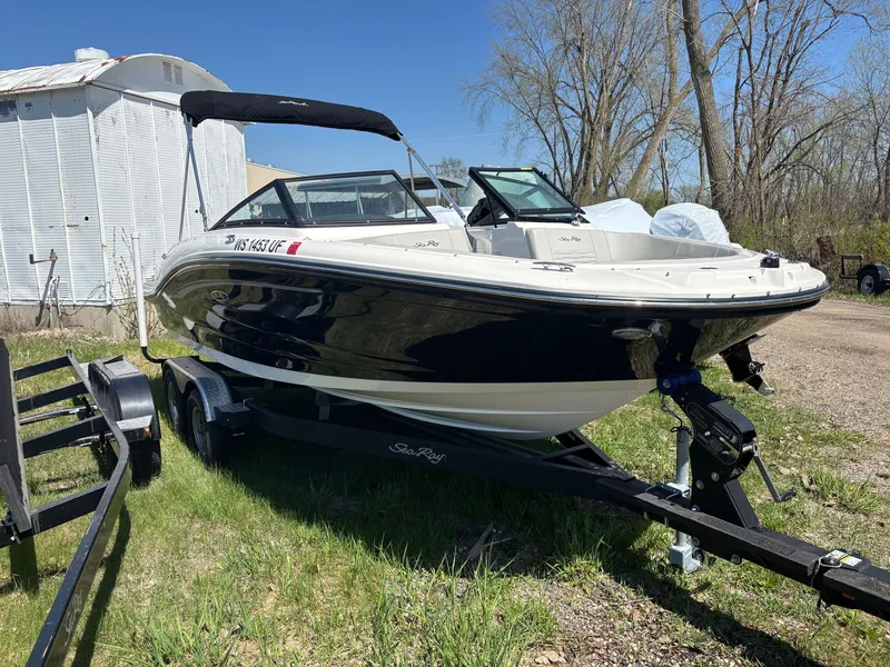Slide: The Image of 2022 Sea Ray SPX 190 boat parked on trailer outdoors. - 2