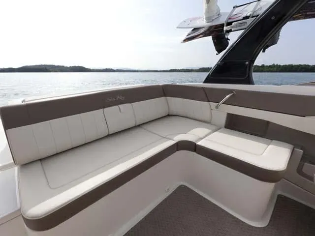 Slide: The Image of Interior of a 2013 Sea Ray SLX 230 with cup holder. - 18