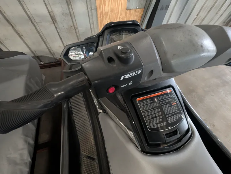 Slide: The Image of Handlebars of a 2015 Yamaha VX1100B-PB jet ski in a garage. - 5