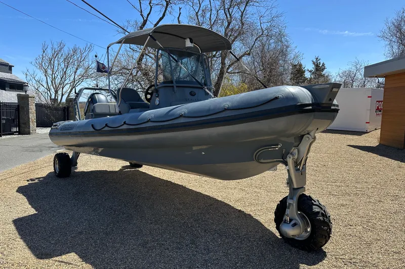 Slide: The Image of 2018 Sealegs 7.7 Amphibious RIB with wheels, parked on gravel driveway. - 10