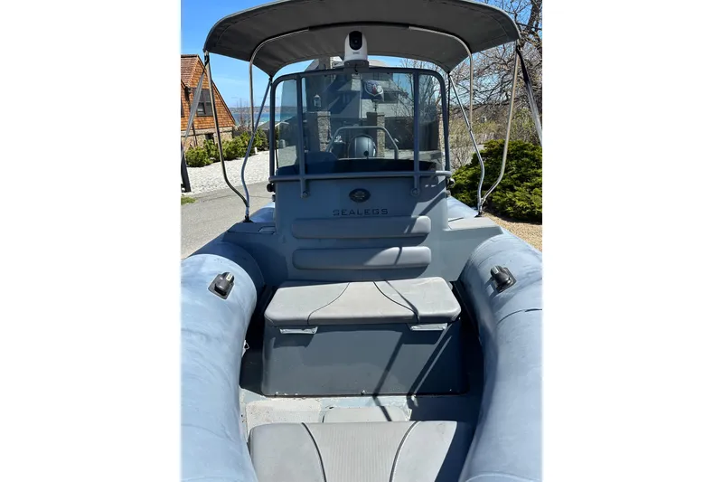Slide: The Image of 2018 Sealegs 7.7 Amphibious RIB with canopy, parked on land. - 15
