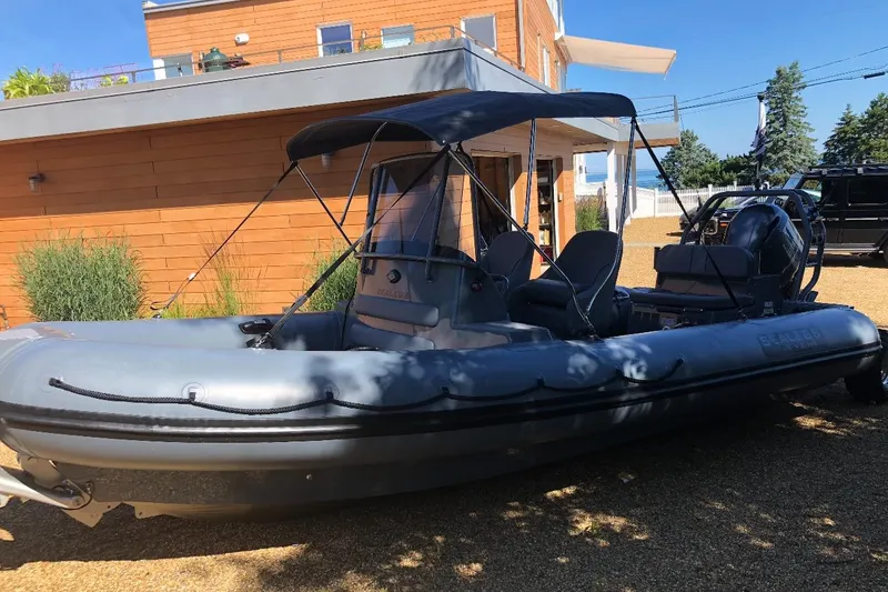 Slide: The Image of 2018 Sealegs 7.7 Amphibious RIB parked outside modern house on sunny day. - 3