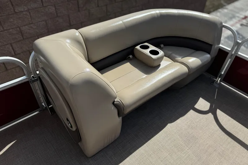 Slide: The Image of 2023 Sun Tracker Party Barge 18 DLX seating with cup holders, beige upholstery. - 11