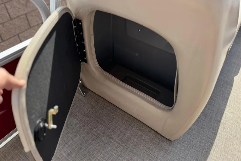 Slide: The Image of Open storage compartment on 2023 Sun Tracker Party Barge 18 DLX pontoon boat. - 12