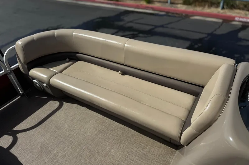 Slide: The Image of 2023 Sun Tracker Party Barge 18 DLX beige seating area on a pontoon boat. - 13