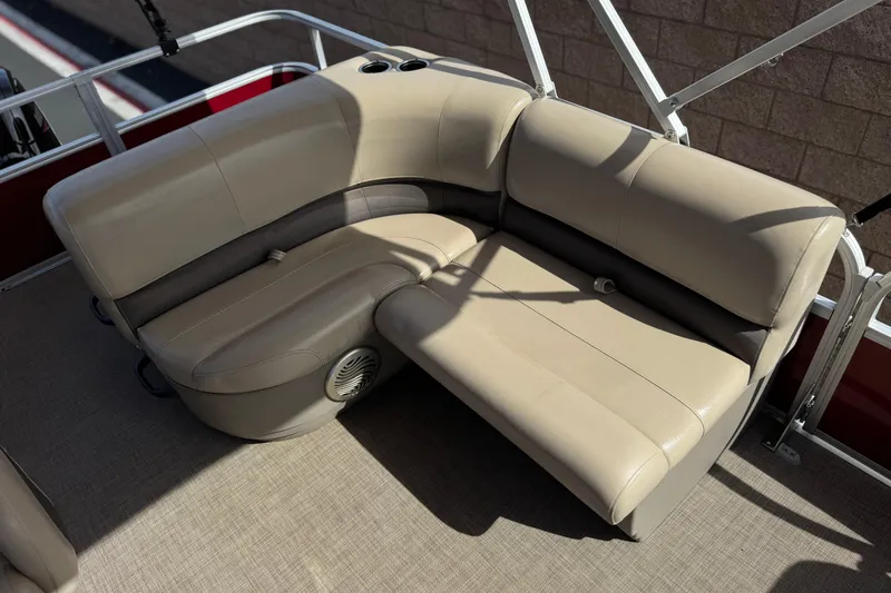 Slide: The Image of 2023 Sun Tracker Party Barge 18 DLX beige seating with cup holders and speaker. - 16