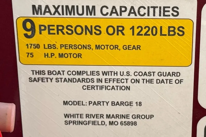 Slide: The Image of 2023 Sun Tracker Party Barge 18 DLX capacity label: 9 persons or 1220 lbs, 75 HP motor. - 27