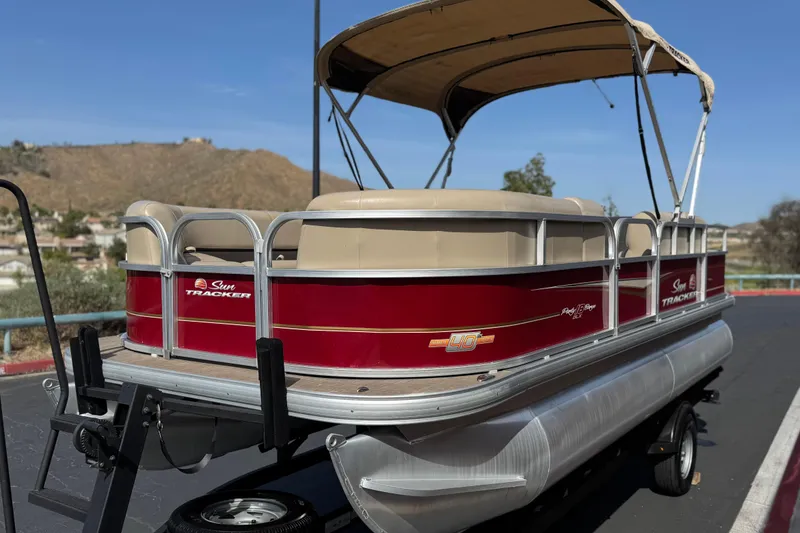 Slide: The Image of 2023 Sun Tracker Party Barge 18 DLX pontoon boat with canopy on trailer. - 3