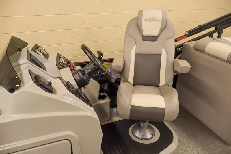 Slide: The Image of 2024 SunChaser Eclipse 8525 LR DH boat interior with captain's chair and steering console. - 11