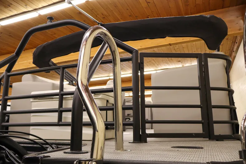 Slide: The Image of 2024 SunChaser Eclipse 8525 LR DH pontoon boat interior with sleek metal railing. - 4