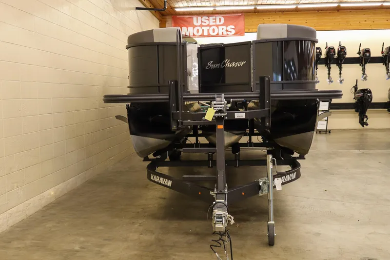 Slide: The Image of 2024 SunChaser Eclipse 8525 LR DH pontoon boat on Karavan trailer in showroom. - 5