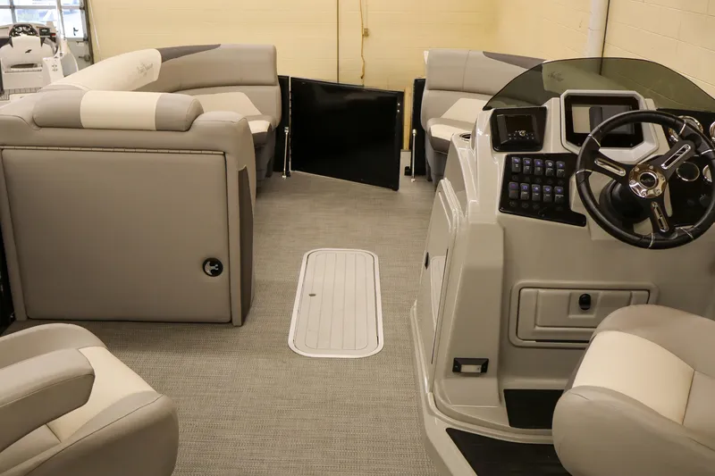 Slide: The Image of 2024 SunChaser Eclipse 8525 LR DH pontoon boat interior with plush seating and modern helm. - 9