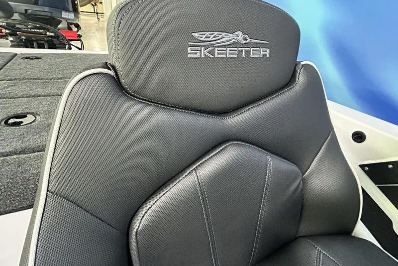 Slide: The Image of 2026 Skeeter ZX150 boat seat with logo, featuring sleek black upholstery. - 13