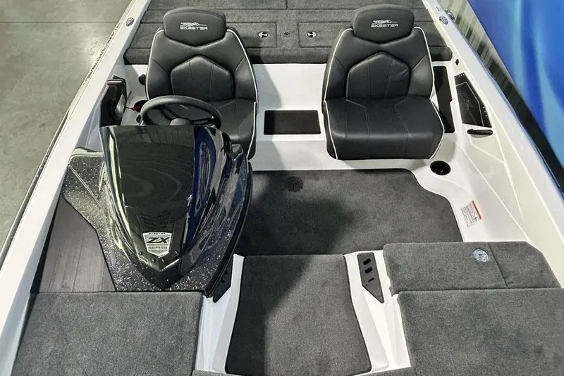 Slide: The Image of 2026 Skeeter ZX150 boat interior with dual black seats and sleek dashboard design. - 14