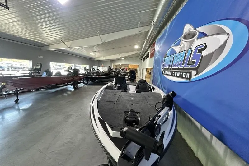 Slide: The Image of 2026 Skeeter ZX150 boat displayed at Foothills Marine Center showroom. - 15