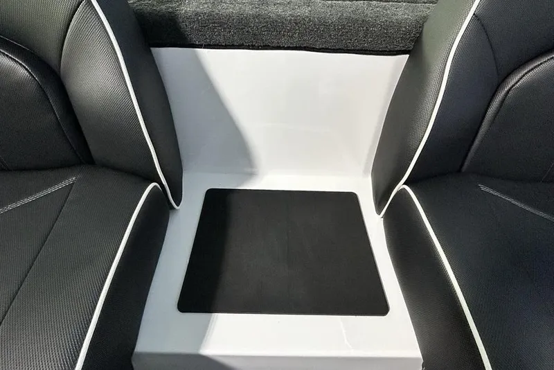 Slide: The Image of Interior seating of 2026 Skeeter ZX150 boat with black and white upholstery. - 19