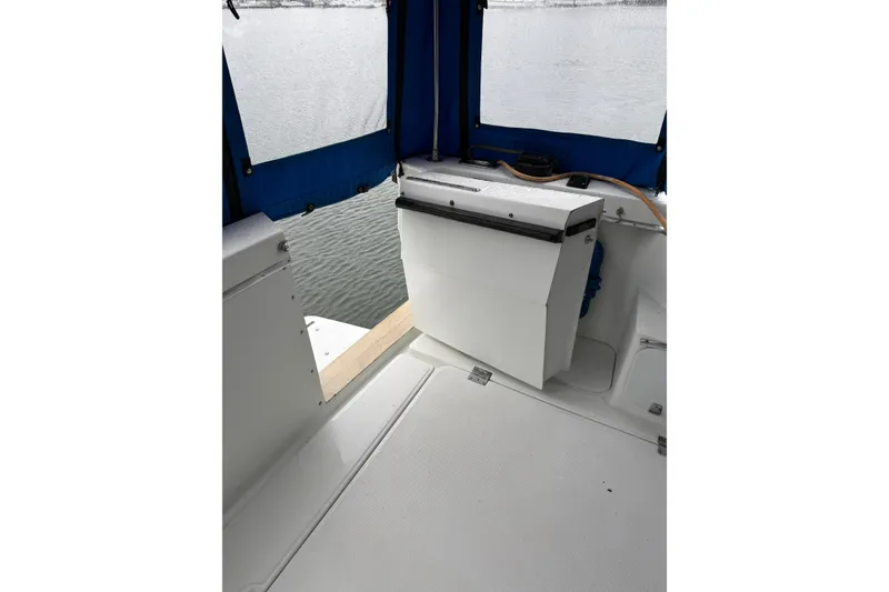 Slide: The Image of 1979 Uniflite 37 Coastal Cruiser interior with blue canopy and white deck. - 17