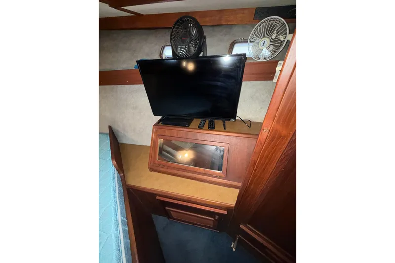 Slide: The Image of Interior of 1979 Uniflite 37 Coastal Cruiser with TV and fans. - 28