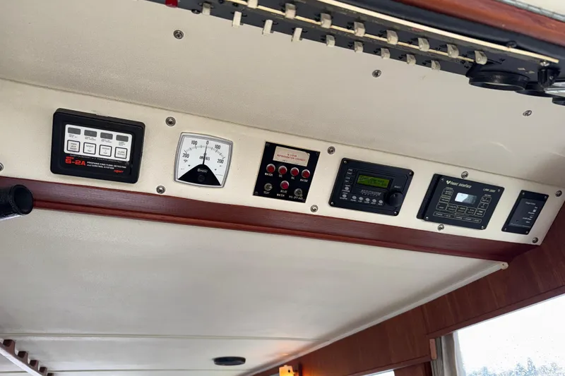 Slide: The Image of Control panel of a 1979 Uniflite 37 Coastal Cruiser with various gauges and switches. - 30