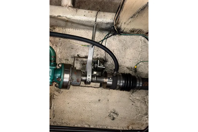 Slide: The Image of Engine compartment of a 1979 Uniflite 37 Coastal Cruiser, showing mechanical components and wiring. - 37