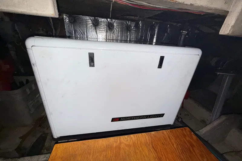 Slide: The Image of Northern Lights generator in a 1979 Uniflite 37 Coastal Cruiser engine room. - 38