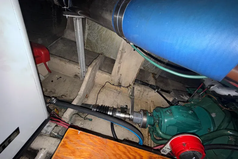 Slide: The Image of Engine compartment of a 1979 Uniflite 37 Coastal Cruiser with visible machinery and components. - 39