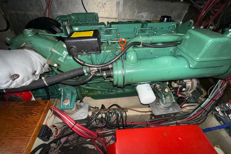 Slide: The Image of Engine compartment of a 1979 Uniflite 37 Coastal Cruiser, showcasing detailed mechanical components. - 40