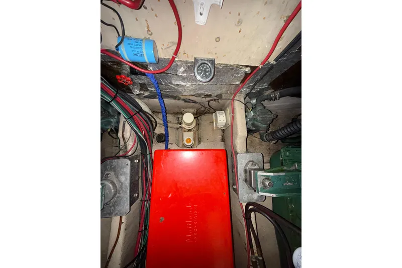 Slide: The Image of Engine compartment of a 1979 Uniflite 37 Coastal Cruiser with wiring and components. - 41