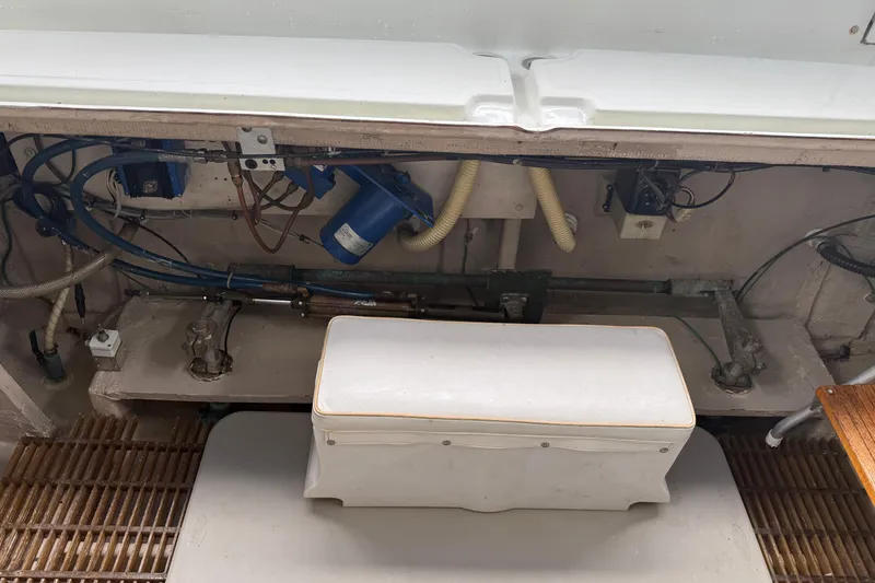 Slide: The Image of 1979 Uniflite 37 Coastal Cruiser engine compartment with visible mechanical components and wiring. - 8