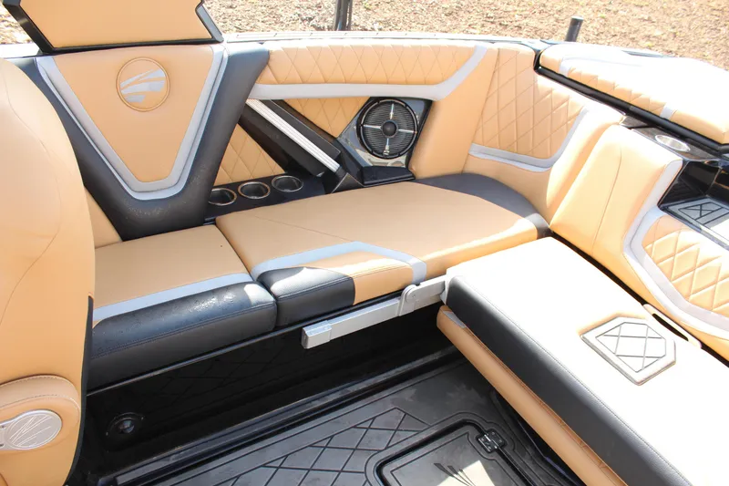 Slide: The Image of Luxurious interior of 2022 Tigé 23ZX boat with tan and black seating. - 13
